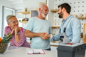 Couple speaking with home inspector